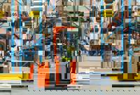 Forklift driver in warehouse
